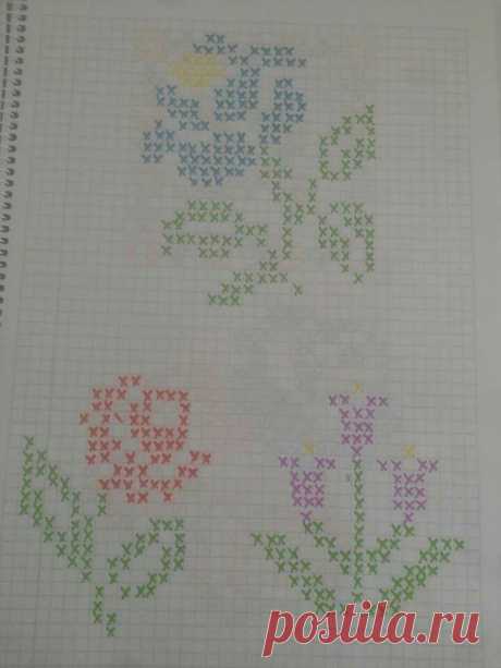 three cross stitch designs on a sheet of paper with the words love written in different colors