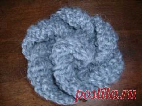 knitted flower pattern (as well as patterns for other basics like hats and scarves), for those of us who don't crochet.  :)
