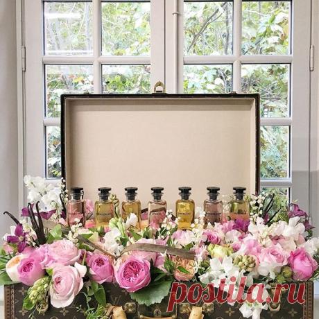 An LV trunk stuffed with flowers and bottled fragrances? Hell yea 🍃 #LVParfums