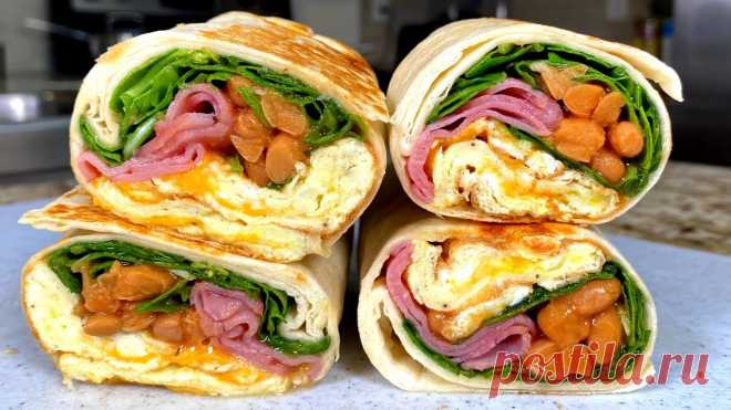 Вкуснятина НА ЗАВТРАК за считанные минуты! Что приготовить на завтрак. Блюда из яиц на завтрак. Продукты:Лепешка пшеничная или лаваш 2 шт.Яйцо 3 шт.Сыр 50 граммКолбаса 80 граммРукола 1 стаканФасоль в томатной подливе 3 столовые ложкиПодсолнечное масло, соль, перец, сухой чеснок и сливочное масло по желанию