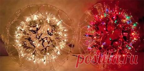 Светящийся шар из пластиковых стаканчиков 

Вам понадобится: 
- прозрачные пластиковые стаканчики 50 шт. 
- прищепки 
- степлер 
- новогодняя гирлянда с 50 узкими лампочками

Проделайте небольшое отверстие в основании всех 50 стаканчиков. Отверстие нужно для того, чтобы туда поместить лампочку. 

Начинаем собирать шар. Соедените два первых стаканчика степлером. 
Затем третий стаканчик все также присоеденяем степлером. И так по кругу 12 стаканчиков. Приступаем к второму ряд...