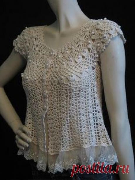 Sweet circa 1980s hand crocheted baby doll top adorned with pearl-like beads and trimmed in lace. There are no labels, but it is very well made and has been crocheted in one piece. It does up with five pearly white buttons and can be dressed up or down for day or evening. Love it! Photographed on a 5'9" size 3,4 mannequin. Vintage size label: none, but we think this will best fit an XXS to XS