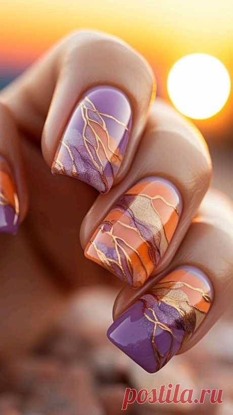 Сочетание оранжевых и фиолетовых оттенков в маникюре создает яркий и стильный образ. Оранжевый цвет ассоциируется с энергией, радостью и теплотой, в то время как фиолетовый символизирует роскошь, таинственность и креативность.