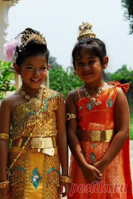 Two happy Thai children in traditional costume