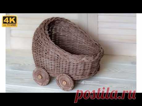 Коляска или колыбель из бумажных трубочек.