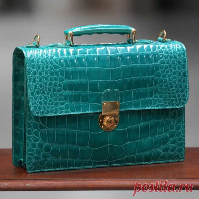 Small azure business case in crocodile leather The most exclusive business case one can imagine, providing space for A4 documents, iPads and 13
