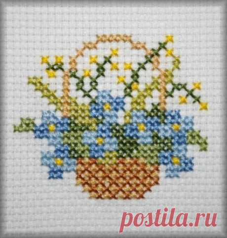 a basket with flowers in it on a white background