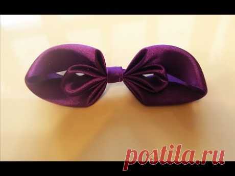 Оригинальный бант из ленты (The original bow of the tape). Делается легко, найдет применение в украшении подарков или элементов одежды.