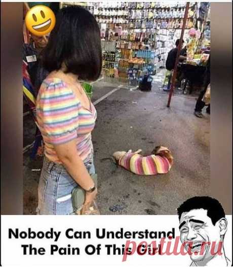 In this picture the funny scene of the girl is present in which what shirt she is with also same shirt a cat or a dog wearing in front of him