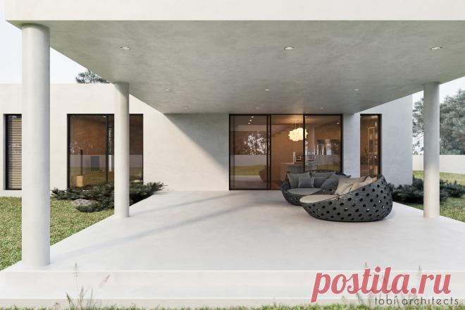 Белоснежный строгий дом стоит на обширном участке в окружении соснового леса. Просторный и минималистичный,в стиле раннего модернизма, он создан для единения с природой, отдыха и созерцания.
Архитектурный образ здания построен на контрастном сочетании его горизонтальных объёмов и вертикалей окружающих сосен. Таким образом все жилище – это прекрасная обзорная площадка.