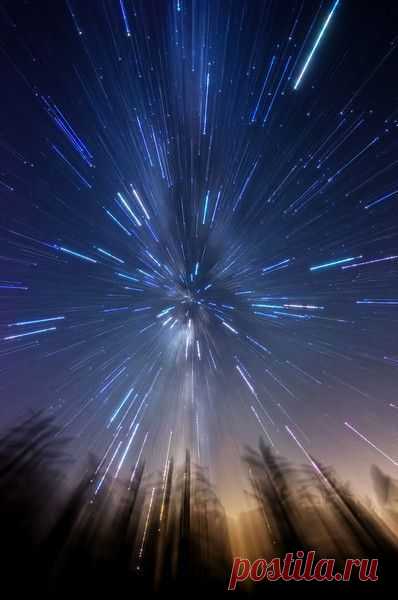 This effect is achieved by manually zooming in from 11 to 16mm during a 25 second exposure of the Milky Way in an open field with some tall weeds in the foreground. Photographed July 31, 2013.
