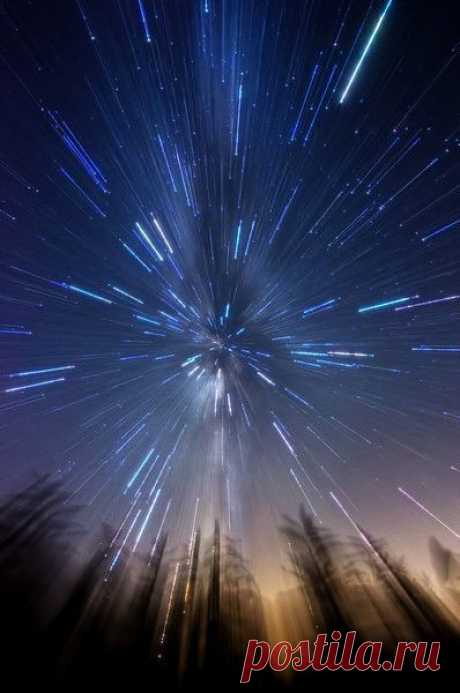 This effect is achieved by manually zooming in from 11 to 16mm during a 25 second exposure of the Milky Way in an open field with some tall weeds in the foreground. Photographed July 31, 2013.
