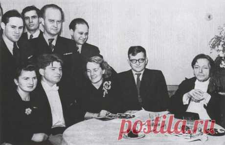 Romanian composer, violinist, pianist, and conductor George Enescu (on right), with (sitting, from right) Dmitri Shostakovich with wife, Nina, pianist Emil Gilels with sister, Yelizaveta; (standing, from left) violinists Mikhail Fichtenholz, Leonid Kogan, composer Vladimir Vlasov, and violinist Boris Goldstein, after Enescu's concert in the Great Hall of the Moscow Conservatory. 21 April 1946.