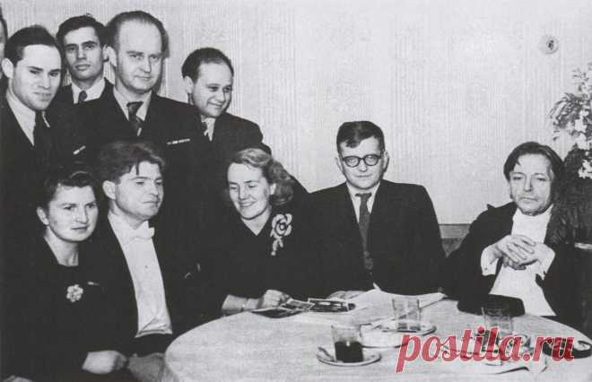 Romanian composer, violinist, pianist, and conductor George Enescu (on right), with (sitting, from right) Dmitri Shostakovich with wife, Nina, pianist Emil Gilels with sister, Yelizaveta; (standing, from left) violinists Mikhail Fichtenholz, Leonid Kogan, composer Vladimir Vlasov, and violinist Boris Goldstein, after Enescu's concert in the Great Hall of the Moscow Conservatory. 21 April 1946.