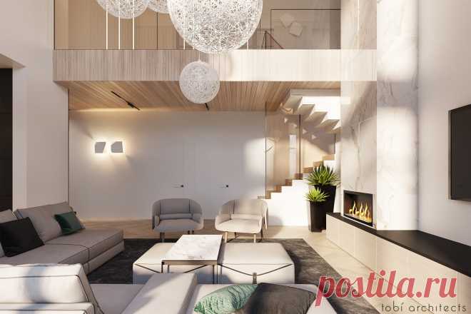 Теплый просторный интерьер нашего Modern House. Интерьер дома зачастую отличается от интерьера квартирного: в нем больше воздуха, пространство сложнее, экстерьер вступает во взаимосвязь с внутренним наполнением и влияет на него. За этим домом раскидывается шикарная панорама на овраг, которая просматривается через огромные витражные окна. Второй этаж объединен с гостиной двусветным пространством, таким образом идя к спальням, мы продолжаем видеть красивый вид из окон.