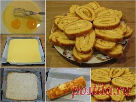 Вкусный рулет на сгущенке 
 
Легкое и очень быстрое в приготовлении лакомство к чаю. 
 
Ингредиенты: 
1 банка сгущенного молока, 
2 куриных яйца, 
250 г муки, 
половина чайной ложки соды гашеной лимонном соком, 
щепотка соли. 
Для начинки вареная сгущенка или творог с изюмом или курагой.
Приготовление: 
1. Взбить яйца со сгущенкой. Постепенно всыпать муку, соль и добавить соду гашеную соком лимона. 
2. Противень выстелить пергаментом или силиконовым ковриком. Если вы используете пергамент, то е