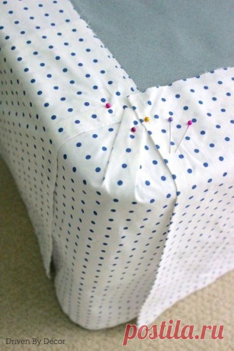 Corner of bedskirt with panels pinned to stay in place