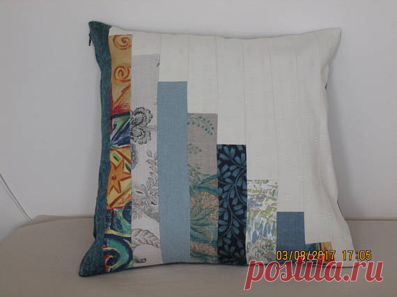 Patchwork Cushion cover This stylish patchwork cushion cover is made from various furnishing fabrics in shades of green/blue. The back is blue and corresponding strips are made from cream furnishing fabric. It has a 41 cm nylon zip. The patchwork side of the cushion is lined with cotton fabric. It requires a