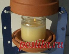 Очаг из горшков обогревает комнату одной свечой