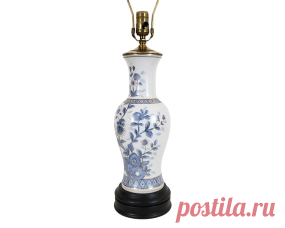 Vintage Asian Blue & White Chrysanthemum Pottery Vase Lamp | Etsy a timeless Kutani porcelain table lamp featuring a hand-painted chrysanthemum motif in pale blue outlined in gold on a crisp white background. the vessel is mounted on a black lacquered base MATERIALS: ceramic, metal, wood  OF THE PERIOD: mid 20th century  PLACE OF ORIGIN: Japan  
$195