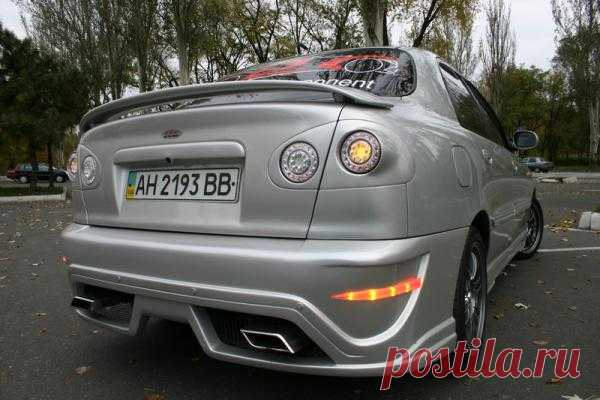 Моделирование переднего бампера,фар с элементами Hella,заднего бампера,стопов с элементами Hella,порогов и спойлера.Поклейка пленки-3м карбон.