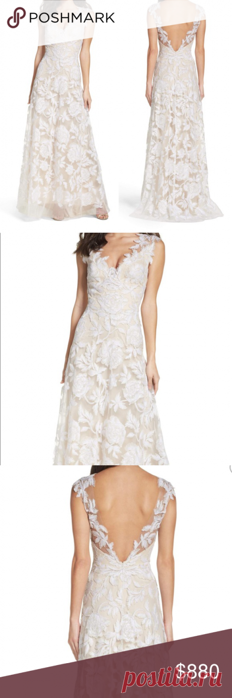 Tadashi Shoji white A-Line Gown NWT  From original order: Runs large; order one size down DETAILS & CARE A classically feminine wedding gown this free-flowing dress features a gossamer tulle overlay that's sweetly embellished with an ornate design of bright white threads. 45 1\/2\ center front length Hidden back-zip closure Plunging V-neck Sleeveless Flowing A-line skirt Lined 80% rayon 20% nylon Dry clean Imported Tadashi Shoji Dresses Wedding