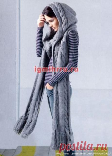 Длинный теплый шарф с крупными «косами» и капюшоном Удобный теплый аксессуар для холодной погоды – шарф с капюшоном. Обращает на себя внимание и выразительный узор из крупных «кос», и объемный капюшон, мягко драпирующийся на плечах, и тяжелые кисти на концах Размеры: Длина шарфа (без кистей) = 210 см...