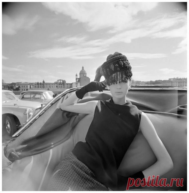 1964 Vogue fashion shoot, a model poses in an open-topped carriage in Florence VOGUE