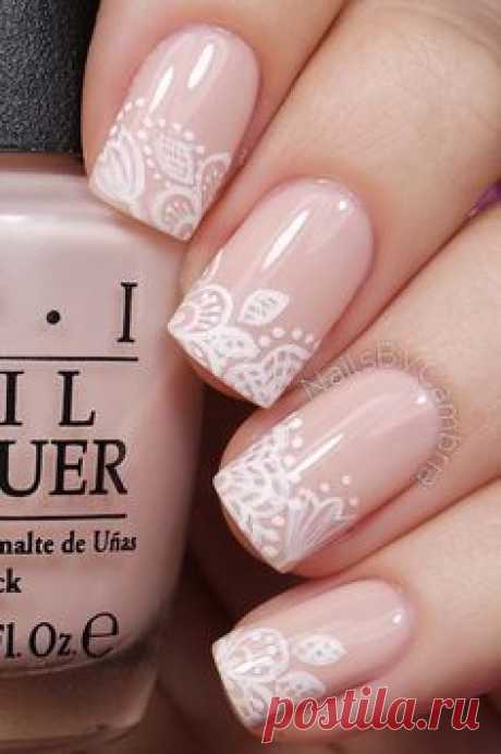 Floral inspired nude nail art. Give life to your nude nails by adding white polish on the tips with flower details on them.
