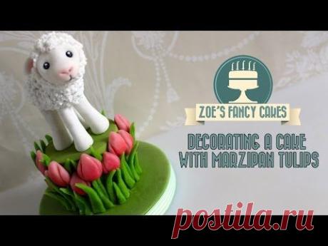 Decorating a cake with marzipan tulips decorating the side of a cake with flowers