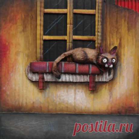 Un chat à  la fenêtre