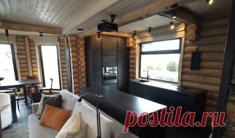 Брутальный дизайн загородного дома с использованием дерева и чёрного цвета.