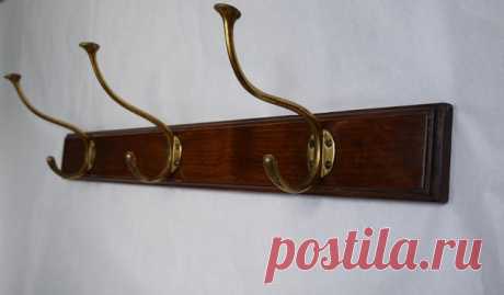 Antique Rack by Adolf Loos Antique coat rack with 3 coat hooks made of brass. The hooks were designed by Adolf Loos for the Cafe Capua in Vienna.