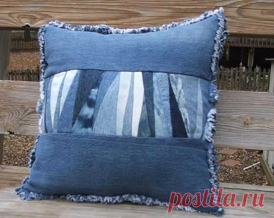 Denim patchwork pillow sham with form. The front is sewn using triangle shaped scraps cut from recycled denim from multiple pairs of jeans.