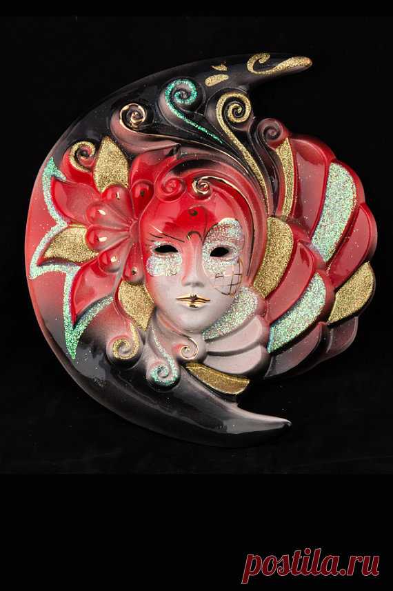 Venetian Mask Eclipsys Eclipsys  Eclipsys: Venetian ceramic mask, handcrafted in Venice by expert craftsmen. The mask was brought first at a temperature of 1050C for the decorations, then to 980C for glazing and to 770C for the gold decorations . After a 50 hour exposure to heating, a superb and original