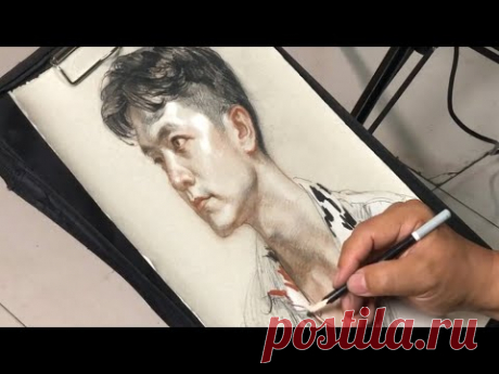 Drawing a portrait with color pencil by artist Yu Xiaodong