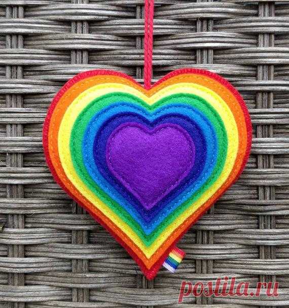 Large Felt Bright Rainbow Heart Ornament  - Rainbow Decoration - Felt Gift - Rainbow Decor I have for sale a cute felt rainbow heart. There are 7 hearts in total, each hand stitched onto the one before.   It measures approximately 10 by 10 cms (4 x 4 inches) not including the hanging loop. They have been lovingly hand stitched using 100% wool felt (the most expensive and best