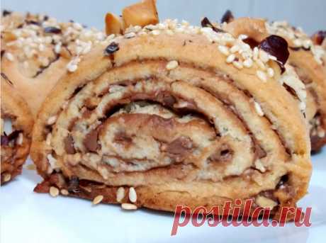 Такого печенья вы еще не ели.Вкуснейшее печенье из песочного теста.Рецепт домашнего печенья Изумительно  вкусное песочное печенье с шоколадной пастой,орехами и сезамом.Рассыпчатое,просто тает во рту.Рецепт песочного теста для печенья очень простой и легкий.ИНГРЕДИЕНТЫ:Мука – 240 грЯйцо -  1 штСливочное масло – 90 грСахар – 50 грМолоко – 1 ст.л.Разрыхлитель -  1 ч.л.Лимонная...