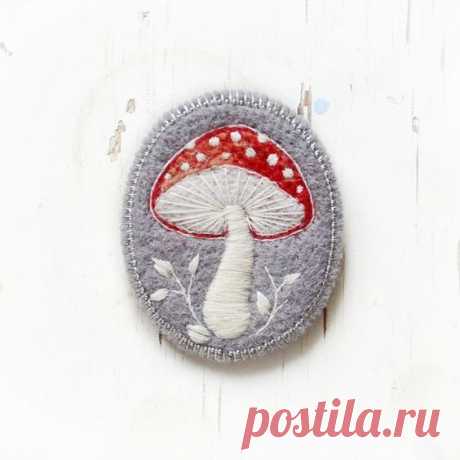 a small patch with a red mushroom on it