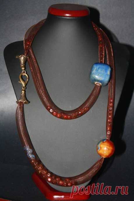 Beautiful 2013 New tubular beaded necklace made with the finest Italian mesh filled with elegant crystal beads & 2 large rich gemstones. $85.00, via Etsy.