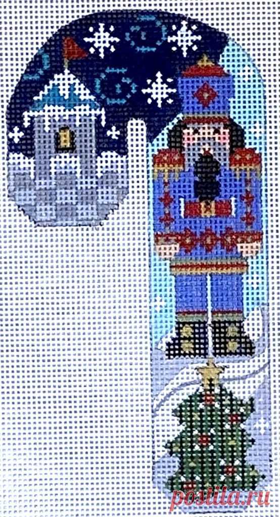 Blue and Red Nutcracker Candy Cane This candy cane features a blue and red nutcracker in front of a castle and Christmas tree. 5.25 x 3
