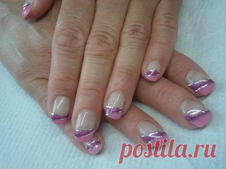 Wedding manicure with glossy colorless base and glittering violet nail polish