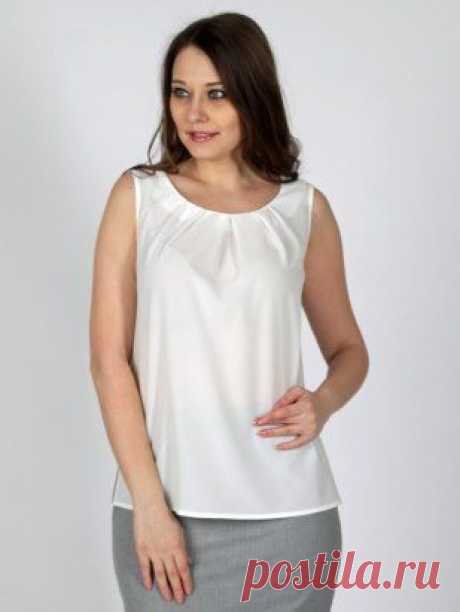 Длина 62-66 см. Блузка из ткани &quot;шелк&quot; прямого силуэта. Горловина с округлым вырезом и мягкими складками. По боковым разрезы.
Ткань : 60%-Вискоза, 37%-ПЭ,3% Лайкра
Размеры 52, 54, 56