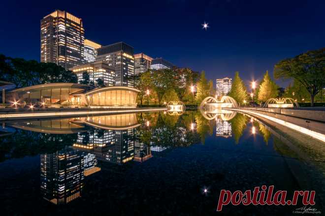 Symmetrical Urban Landscape, Tokyo Marunouchi A scenery of Wadakura Fountain Park in night time, skyscrapers of Marunouchi district with the reflections on the still water. Taken in Marunouchi, Chiyoda-Ward, Tokyo, Japan.  東京都千代田区 和田倉噴水公園にて。 水路への映り込みを対にした構図で、丸の内摩天楼群と噴水が吹き上がるタイミングで捉えた都市夜景。  Pentax K-3, Sigma 10-20mm F4-5.6 EX DC /HSM. On November 5, 2019, 17:57. Focal 10mm / Aperture f11 / ISO100 / Exposure 60s.  RAW development (16bit TIFF) in Adobe Photoshop Lightroom Cla...