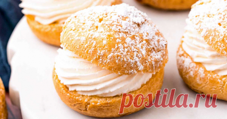 Easy to make at home, these delicate cream puffs come together with a soft, flaky choux pastry, a simple whipped cream filling, and a dusting of powdered sugar.