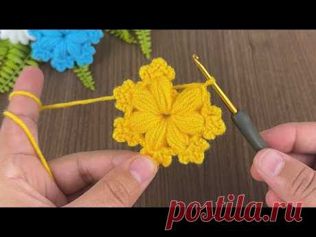 Watch how to make a simple pouf flower