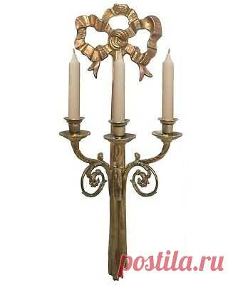 EARLY 20TH C ANTIQUE LG ORNATE BRASS WALL SCONCE, W/RIBBON/SCROLLED 3-ARM DESIGN  | eBay This isn't a shy piece that would humbly sit on a narrow wall in a hallway or foyer, taught to behave itself. It's big, bad and beautiful. A welded, wall-hanging plate is located on the back for sturdy, firm hanging on a wall fastener.