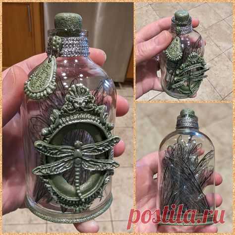 Harry Potter inspired potion bottle made from polymer clay and bow-making wire over a glass bud vase and filled with 2 sizes of wings printed on overhead transparency sheets that were then cut out and crumpled to add texture
