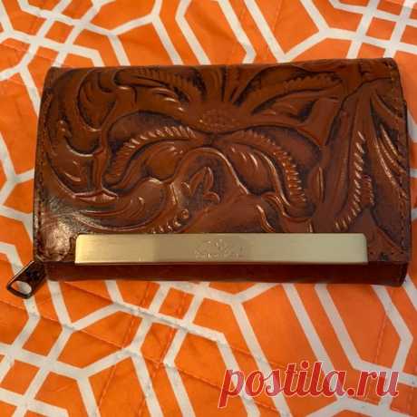 New Patricia Nash fold over wallet. Brown leather. 2 zip compartments inside.  Smoke free/dog friendly home All clothing  items washed, air dried, not ironed.  All known defects/stains pictured & mentioned.