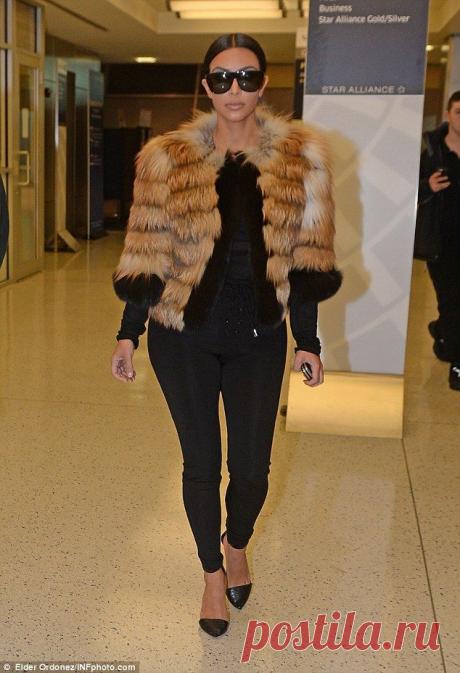 Kim Kardashian flashes cleavage in sheer top as she jets out of NYC